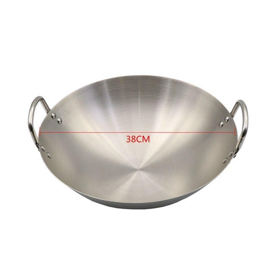Wokken set skråt fra siden, med en streg der viser diameteren på 38 cm
